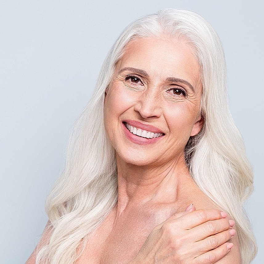 Smiling older woman with long, silver hair