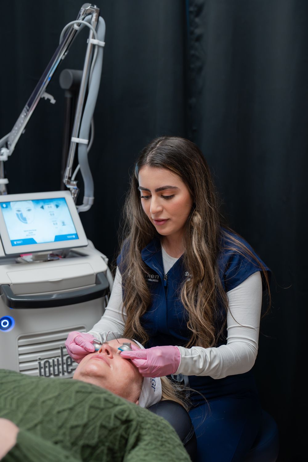 Woman in activewear with long, flowing hair.