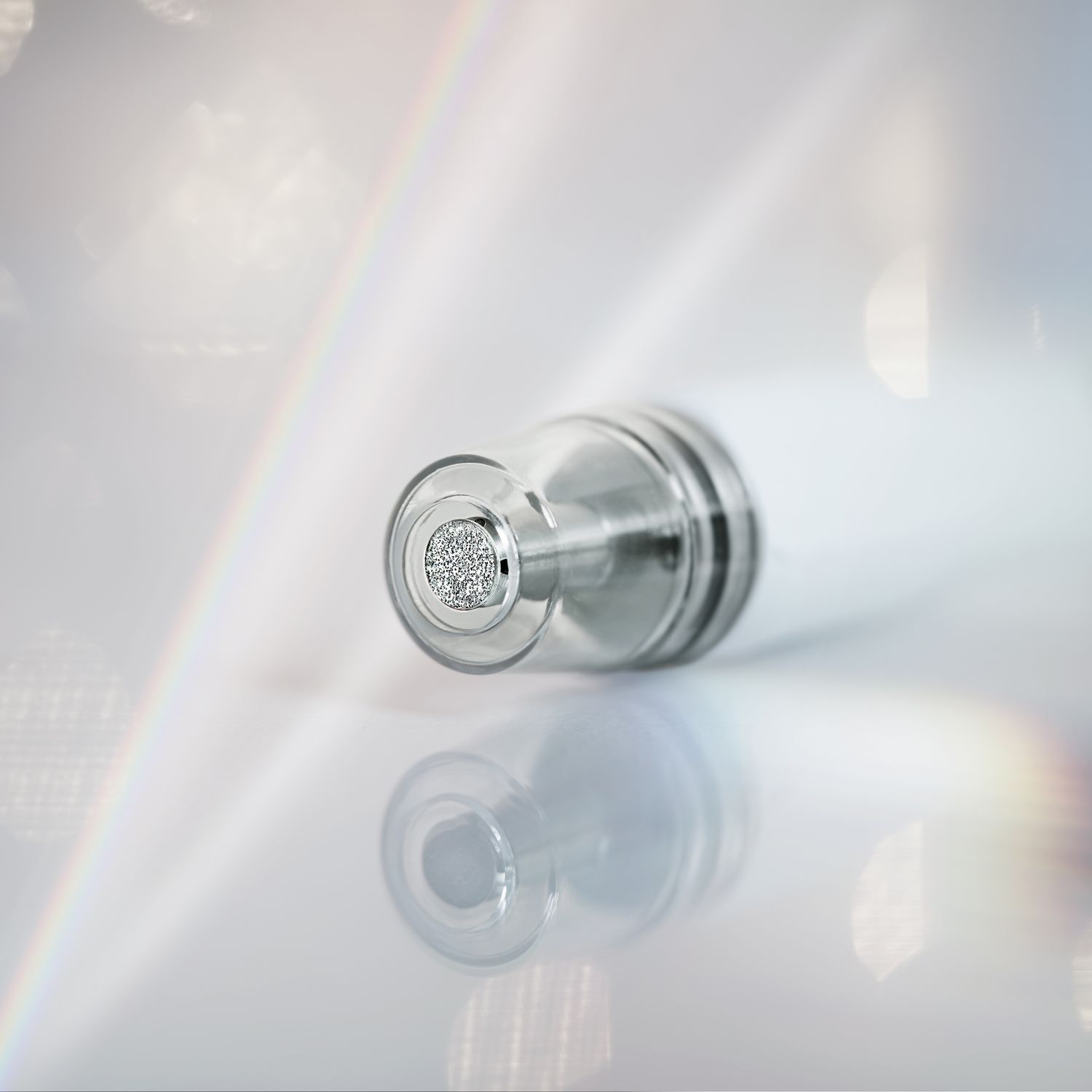 Smiling woman with freckles and curly hair.