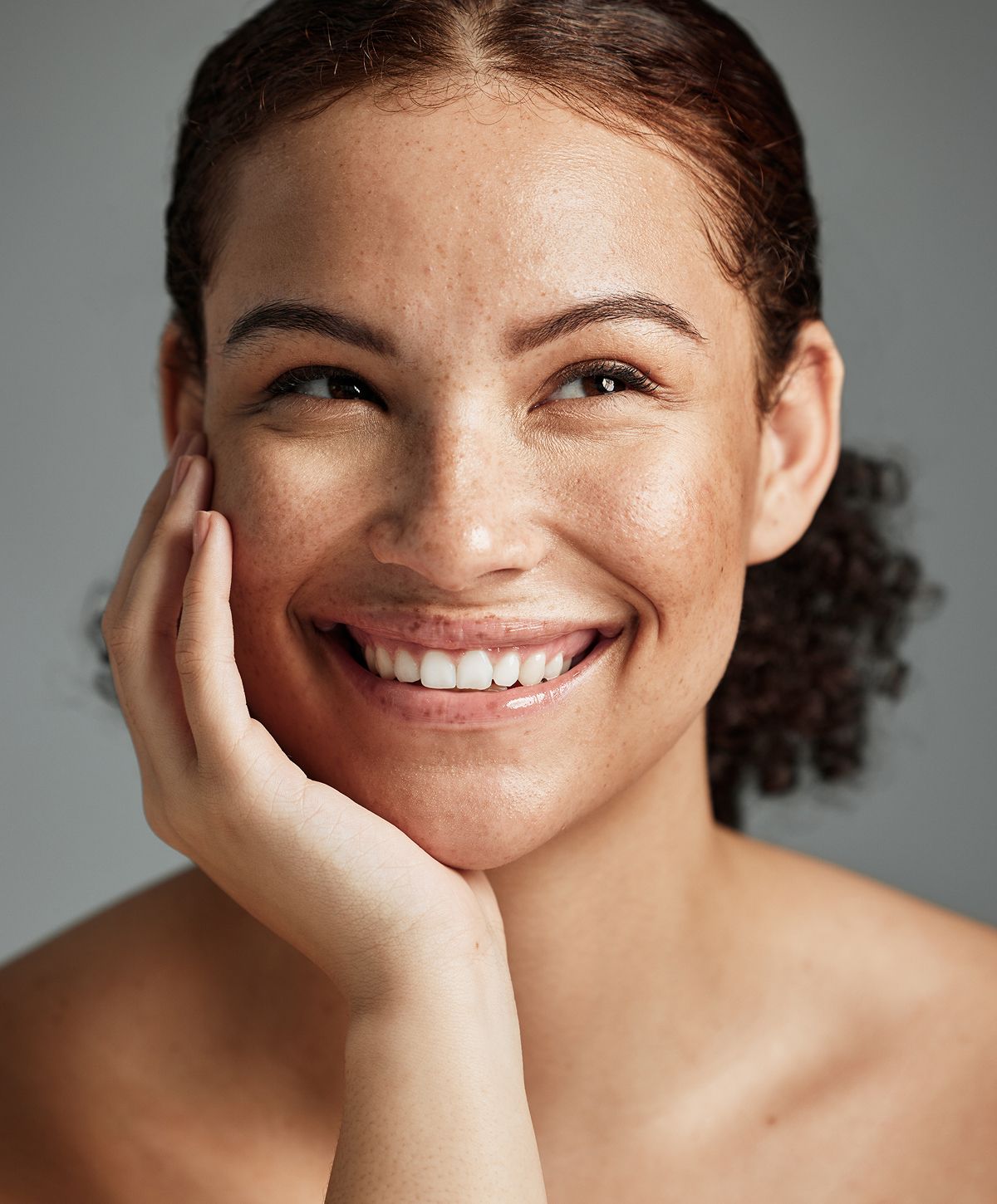 Woman in activewear with long, flowing hair.