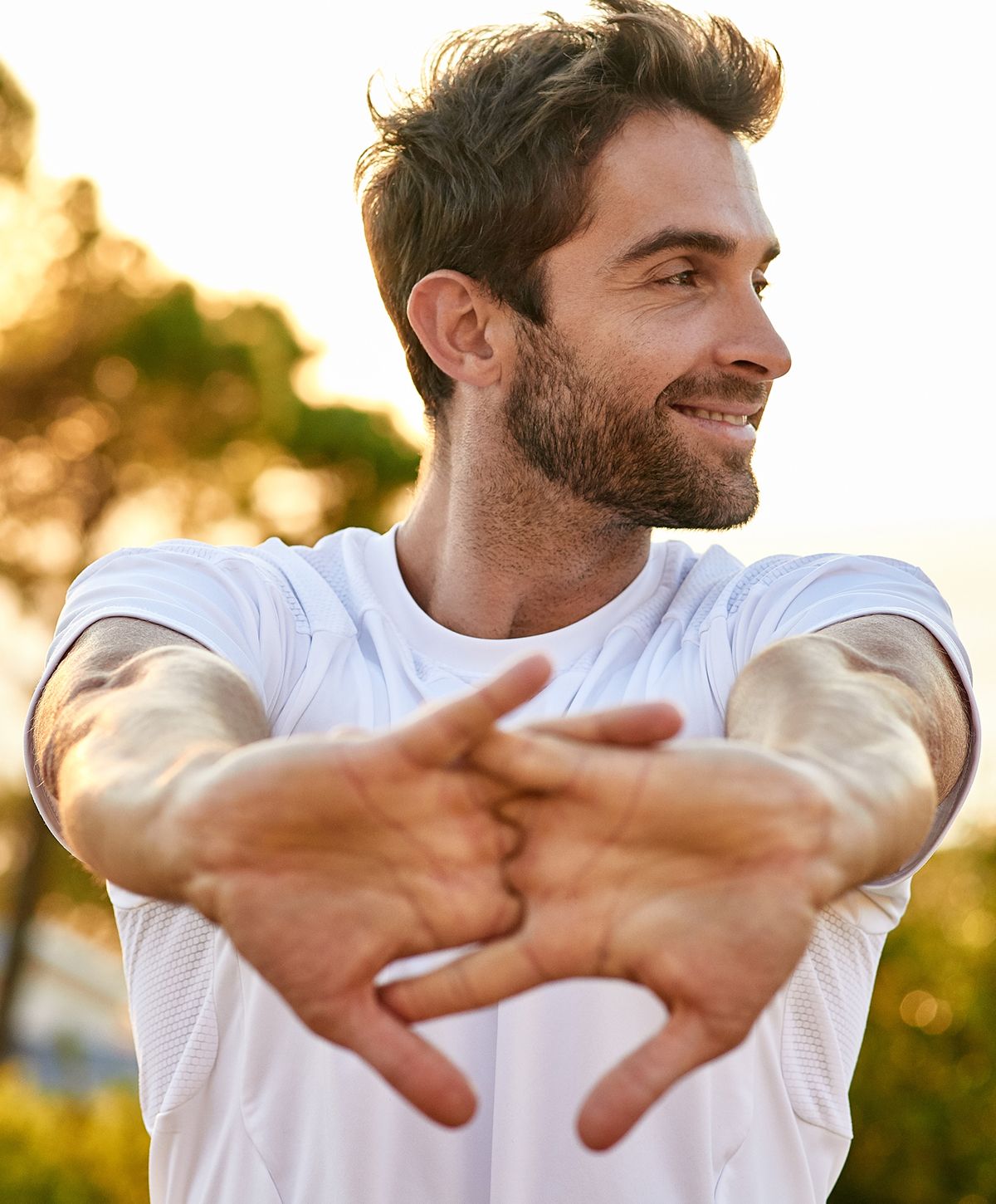 Woman in activewear with long, flowing hair.