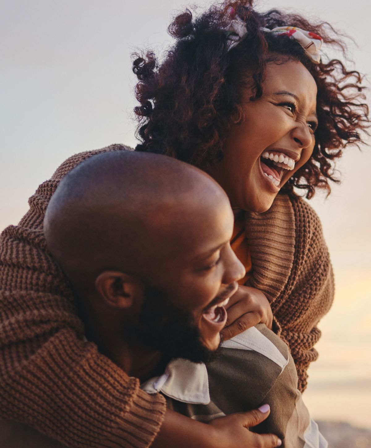 Woman in activewear with long, flowing hair.