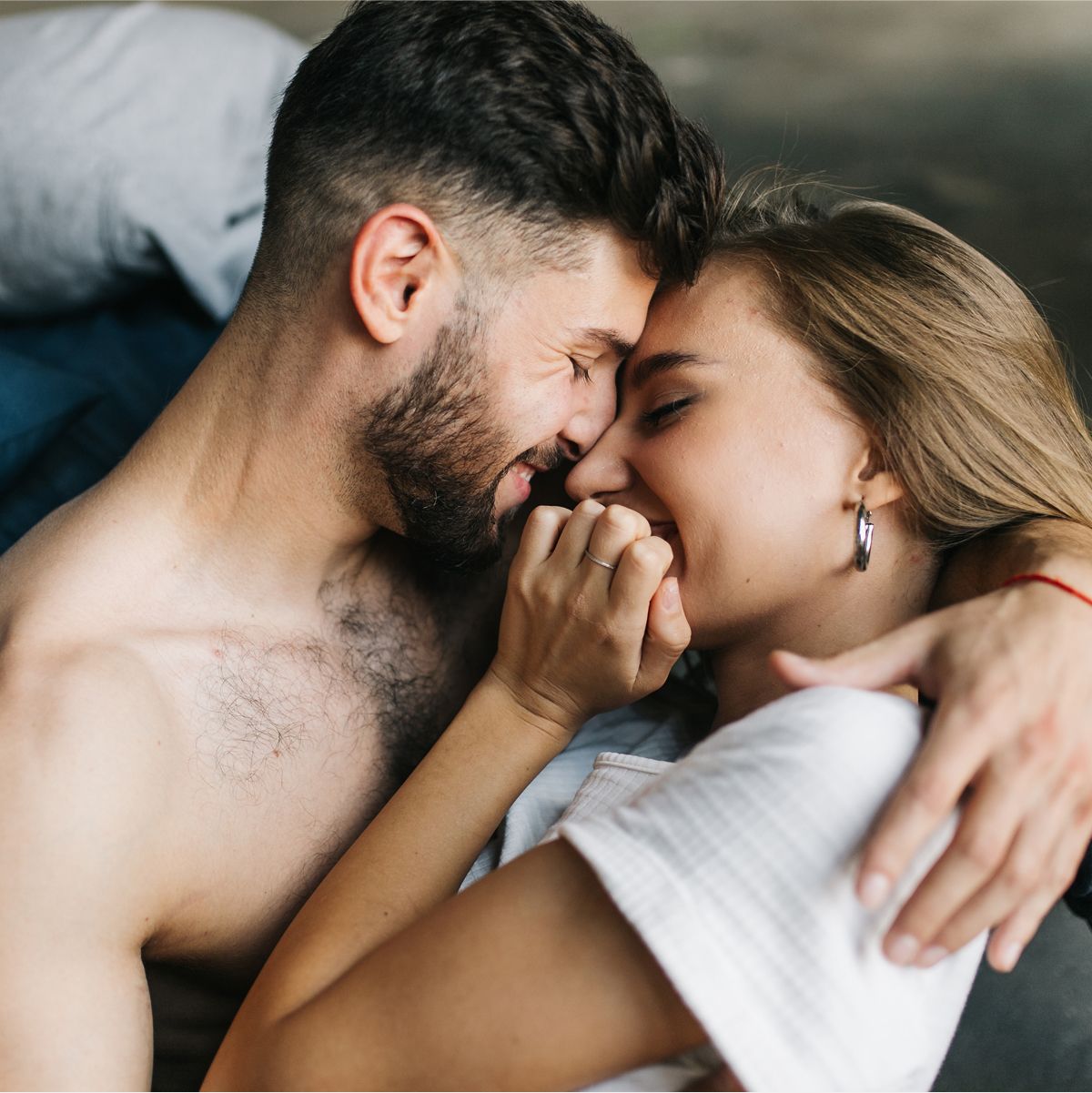 Couple embracing and sharing a playful moment.