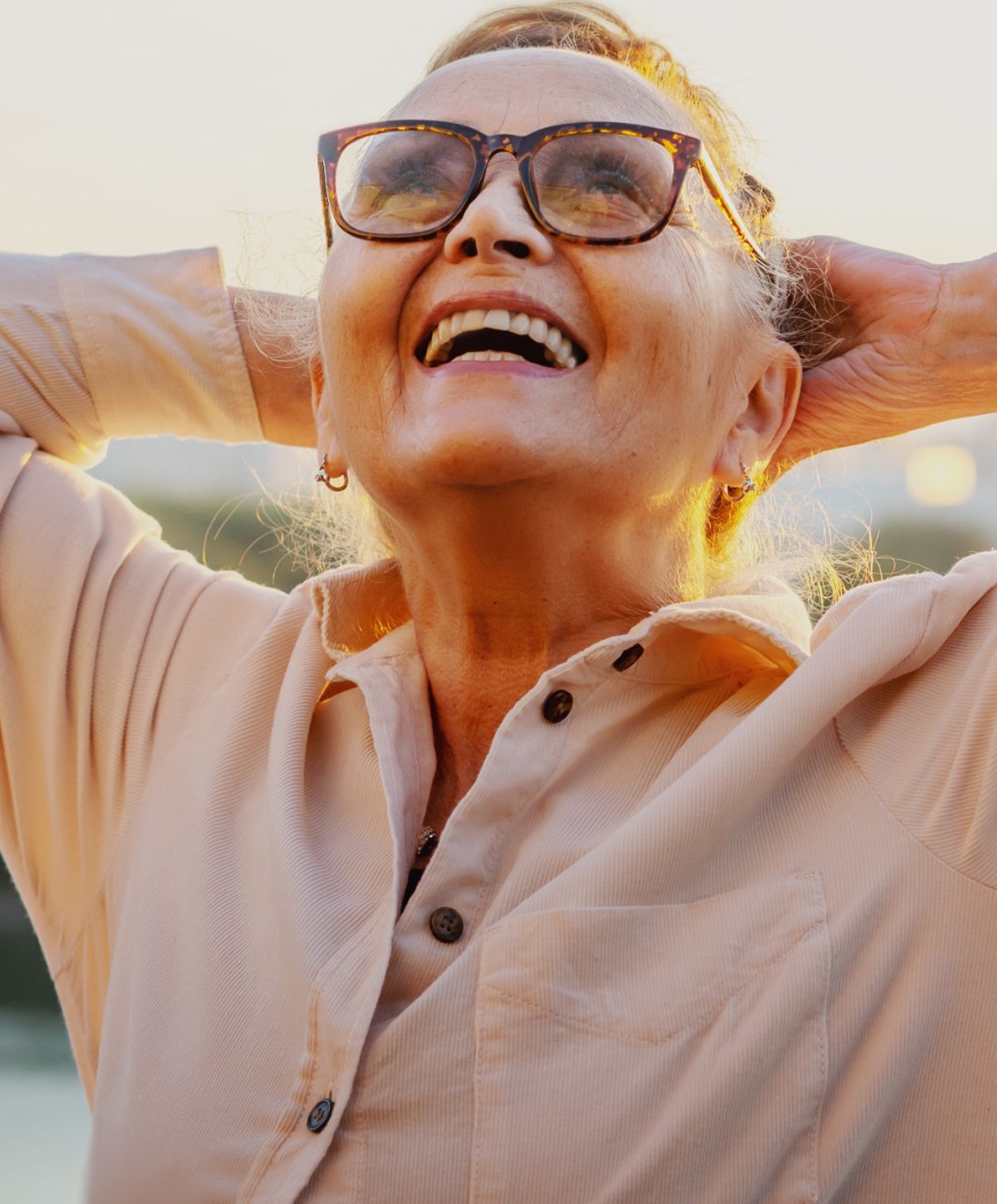 Woman in activewear with long, flowing hair.