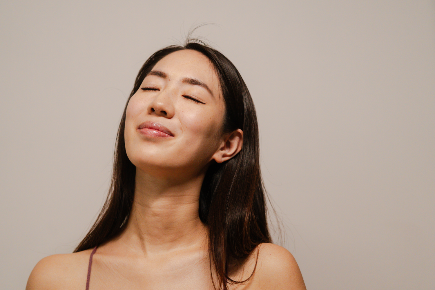 Woman with long hair in a stylish pose.